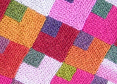 Den ultimative guide til at vælge garn til bløde, strikkede babytæpper